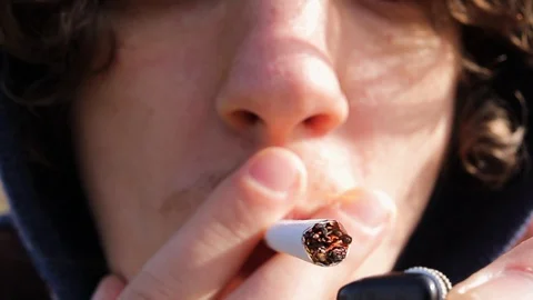 Young man smokes close-up.bad habits Video stock 128451267