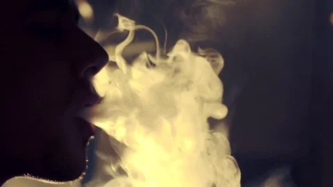 Young man smoking hookah in a bar Stock Footage 83536122