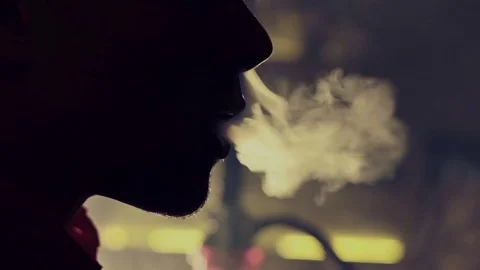 Young man smoking hookah in a bar Video stock 83536999