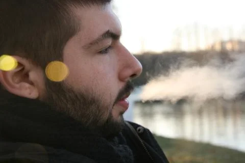 Young Man Smoking Stock Photos