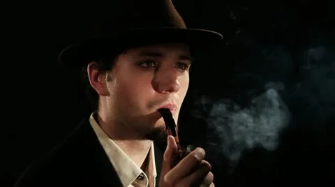 A young man smoking a pipe Stock Footage 11128541