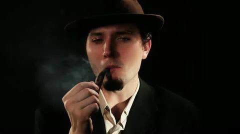 A young man smoking a pipe Stock Footage 11128596