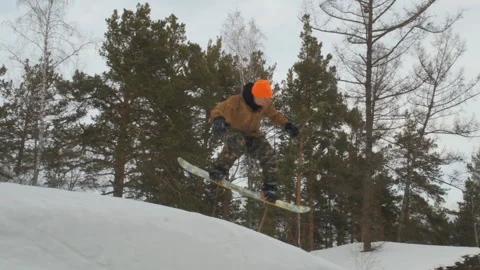 A young man snowboarding. Stock Footage 103170029