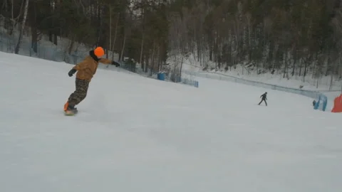 A young man snowboarding. Stock Footage 103190759