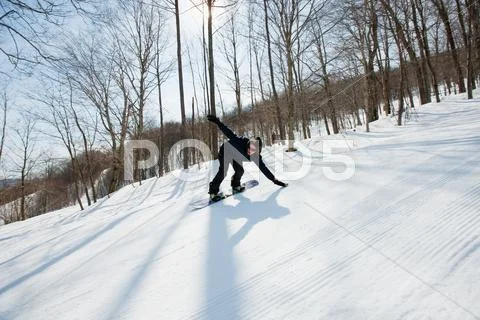 Young Man Snowboarding