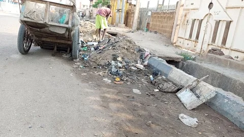 Young Man Sorting Recyclable Plastic From Drainage Waste Kano Nigeria Stock Footage 331071540