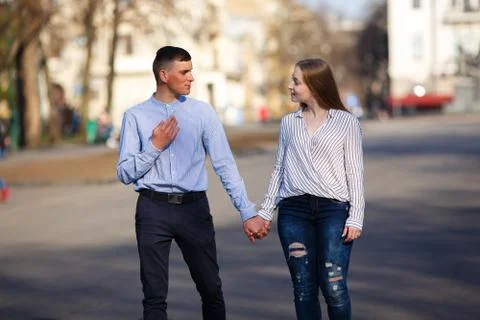Young man speak emotionally while his girlfriend attentively lis Stock Photos