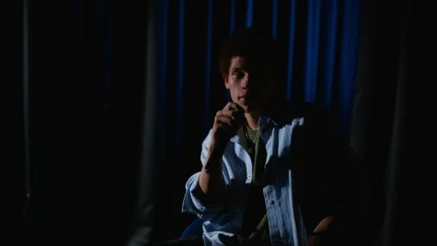 Young Man Speaking with Microphone on Stage during Theater Performance Stock Footage 344528081