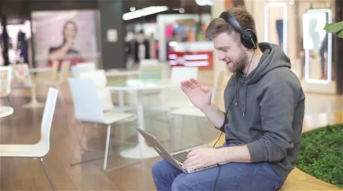 Young Man Speaks Using a Laptop. Stock Footage 47977445