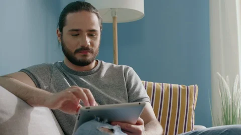 Young Man Spends Time Online 스톡 동영상 129889535