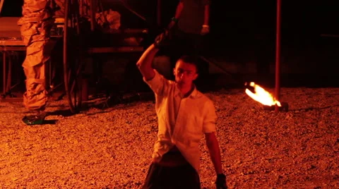 Young man spinning fire Stock Footage 60563702