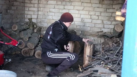 Young Man Splitting Firewood with Ax. Includes Audio. Stock Footage 126952095