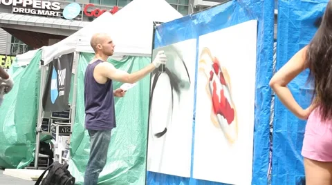 Young man spraying graffiti Stock Footage 40668855