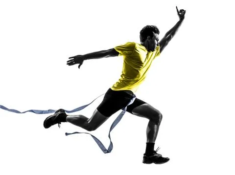 Young man sprinter runner running winner finish line silhouette Stock Photos