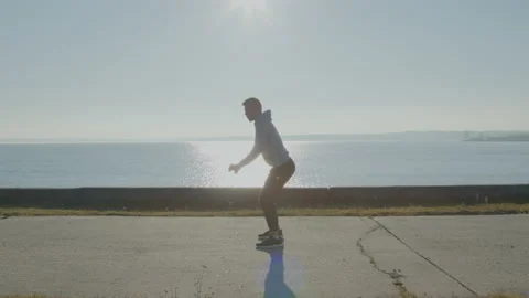 Young Man Is Squatting In Park Stock Footage 166349353