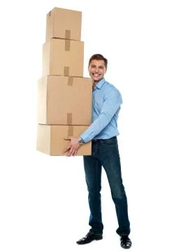 Young man with stack of cartons Stock Photos