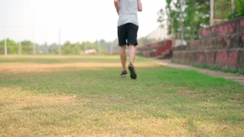 Young man at the stadium preparing to run, slow motion video. Video stock 231336191