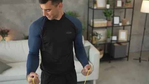 Young man stand and exercise with rubber resistance elastic band Stock Footage 278333014