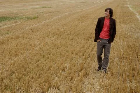 Young man standing in a field Stock Photos