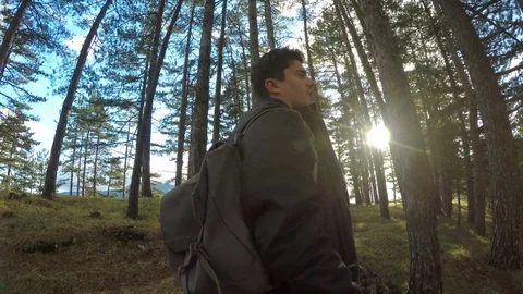 Young man standing in forest 库存影片 86737968