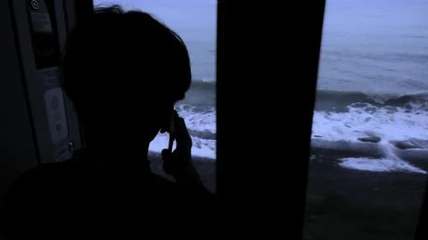 Young man standing next to a train window and looking outside Stock clip. Man Stock Photos
