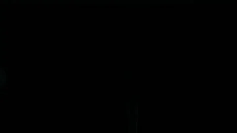 Young man stands by the panoramic window and opens the curtain Stock Footage 273825990