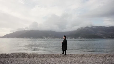 Young man start drone. The operator grips the control panel of a quadcopter Stock Footage 307239882