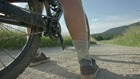 A young man starting to ride his bike into the distance Video stock 107571925