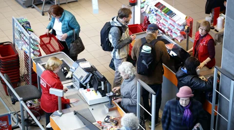 Young man stealing something and leaving the supermarket very fast Stock Footage 39796759
