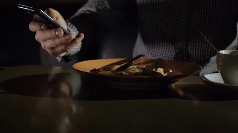 Young man stirring tea with spoon Stock Footage 70864918