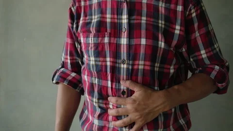 A young man with a stomachache Stock Footage 153155234