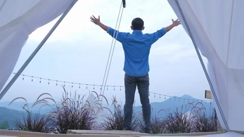 The young man stood looking at the mountain view Stock-Footage 136667098