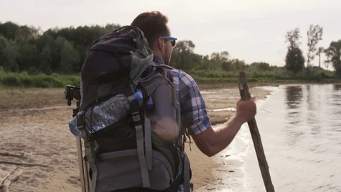 Young Man Stopping to Walk in the Wild Stock Footage 76467152