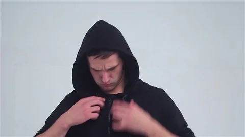 Young man straightens of clothes, looking in the mirror. Stockbeeldmateriaal 72996327