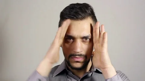 Young man straightens of clothes, looking in the mirror. Stock-Footage 75348355