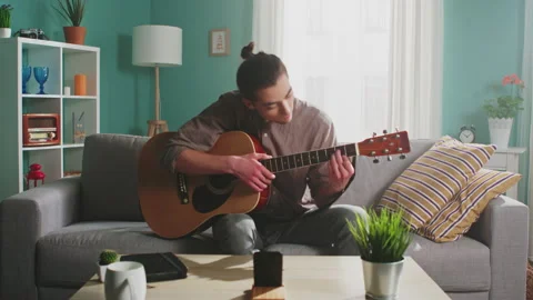 Young Man Is Streaming Guitar Playing Stock Footage 149262557