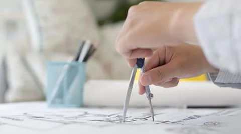 Young man  structural design or engineer is using a measuring circle around a Stock Photos