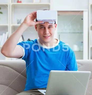 Young man student studying with virtual glasses Stock Photos