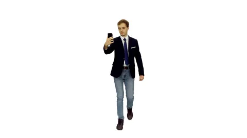 Young man student in suit jacket having video chat while walking, alpha channel Video stock 121662985