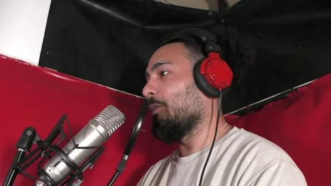 Young man in studio booth. Stock Footage 114020919