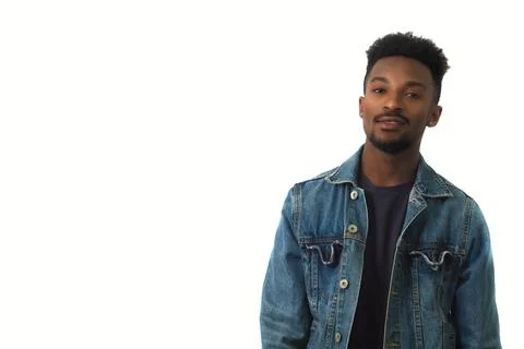 Young man studio portrait handsome male wearing blue jeans jacket in studio Stock Photos