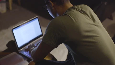 Young Man Studying and Working on Laptop Computer Video stock 208710596