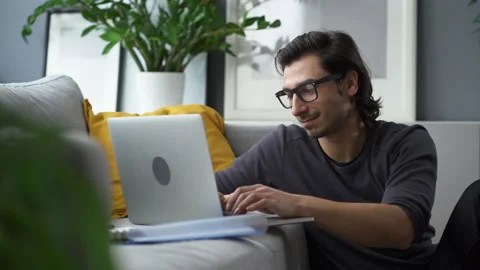 Young man studying from home Stock Footage 149243611