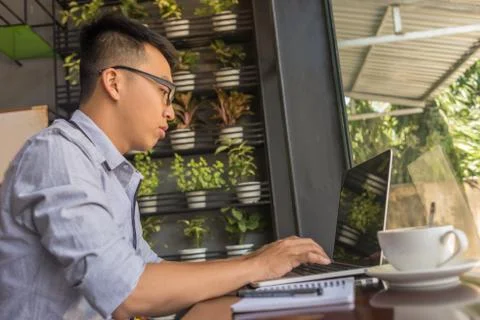 Young man studying on laptop Stock Photos