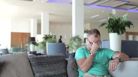 Young man suffer because of headache. Too much sunbathing Video stock 53569380