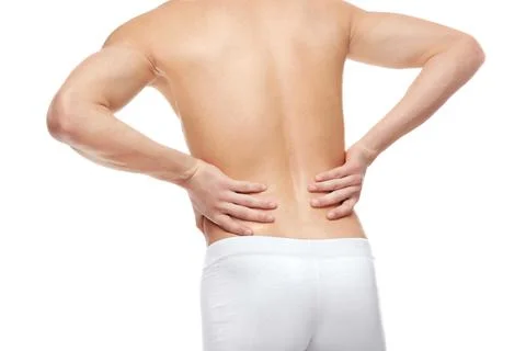 Young man suffering from back pain on white background Stock Photos