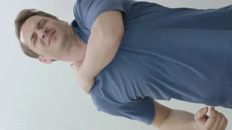 Young man suffering from back, shoulder and neck pain.Health problem. Stock Footage 201012689