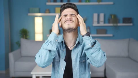 Young man suffering from headache. Stock Footage 236246985