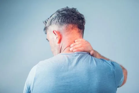 Young man suffering from neck pain. Headache pain. Stock Photos