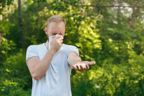 Young man suffering spring pollen allergy Stock Photos